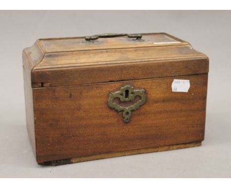 A Georgian mahogany tea caddy and a book form box. The caddy 23 cm wide.