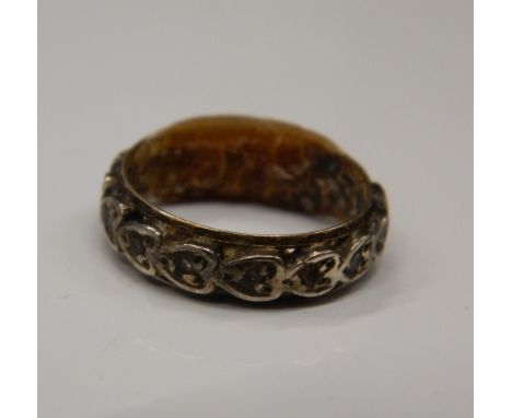 A diamond set gold eternity ring (2 grammes total weight).