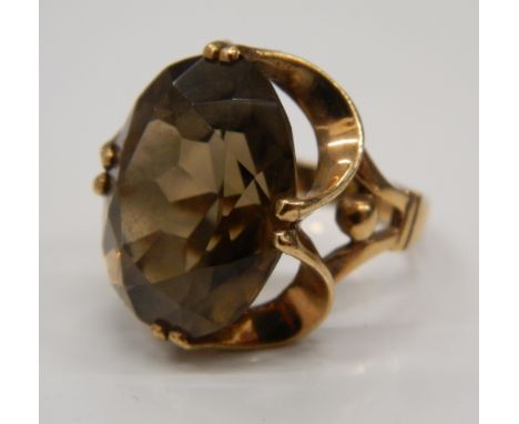 A 9 ct gold large smoky quartz ring. Ring size M/N (10 grammes total weight)