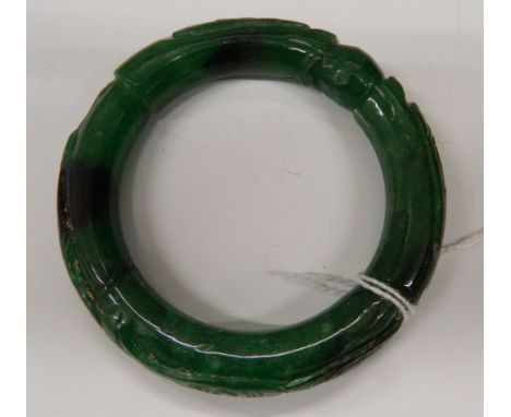 A jade bangle.  8 cm outer diameter.