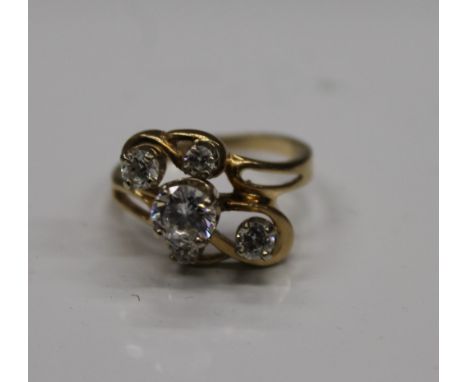 A 14 K gold white stone ring, the larger central stone surrounded by four smaller stones. Ring size N (4.2 grammes total weig
