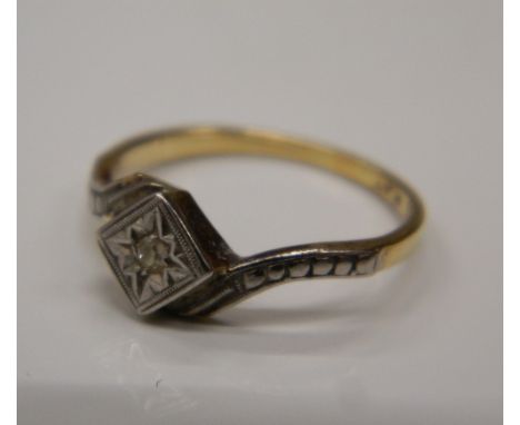 An 18 ct gold and diamond ring. Ring size K (1.8 grammes total weight)