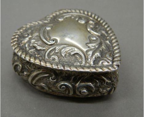 A silver heart shaped trinket box.  5 cm wide (32.5 grammes).