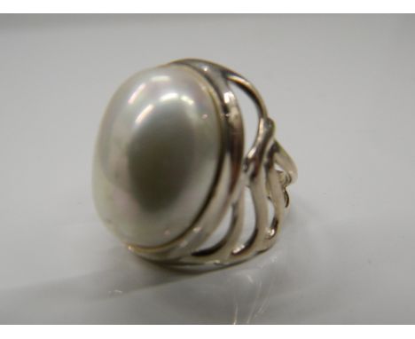 A silver dress ring. Ring size P.