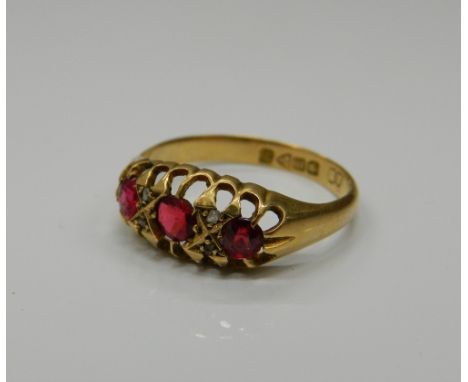 An 18 ct gold ruby and diamond ring. Ring size O/P (2.3 grammes total weight)