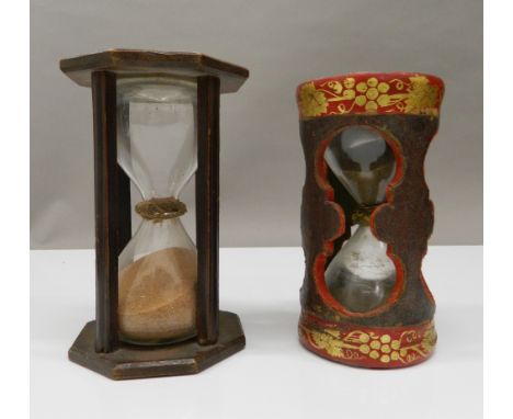 A 19th century treen sand timer, 16.5 cm high, together with a leather covered sand timer