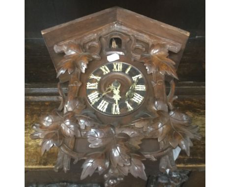 A Black Forest cuckoo clock. 30 cm wide.