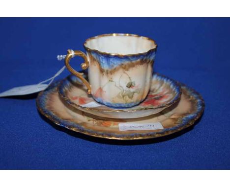 THREE NAUTILUS TRIOSof cup, saucer and side plate, decorated with flower within blue and gilt borders ((9)