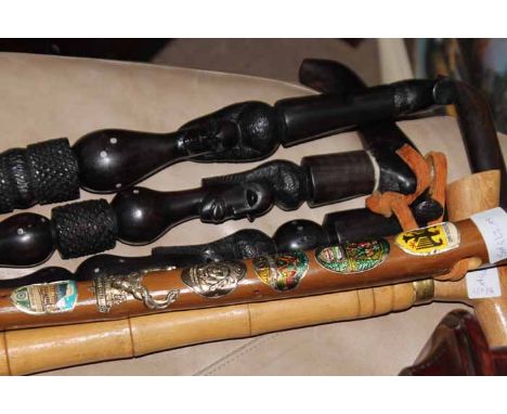 THREE MOSAMBIQUE EBONY WALKING STICKS also a German walkers stick and another (5)