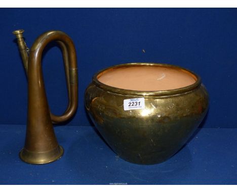 A brass/copper Bugle horn and an Indian design brass/copper jardiniere.