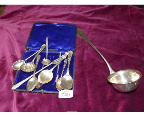 A quantity of miscellaneous teaspoons, sugar sifters, pickle fork and a serving ladle.