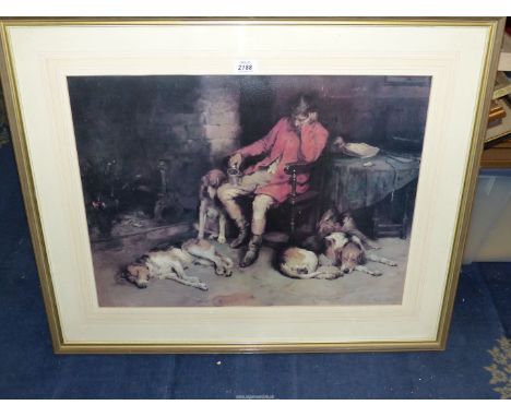 A large framed Philip E. Stretton print of a Hunt Master asleep in a chair by the fire with hounds asleep at his feet, 31 1/4