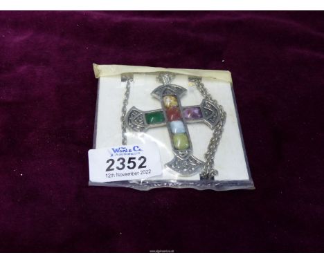 A large Celtic cross on chain with six multi coloured stones.