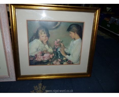 A large framed Print depicting a ballet dancer along with a framed and mounted G. Clausen print of two girls arranging flower