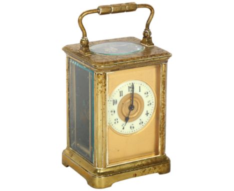A French brass-cased 8-day carriage clock, with gilded dial, height not including handle 12cm, complete with key, not seen wo