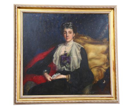 A large Victorian oil on canvas, portrait of a lady seated on an armchair, script to the bottom right-hand corner of the pain