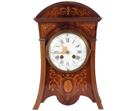An Art Nouveau mahogany and satinwood inlaid 8-day mantel clock, with enamelled dial, complete with key and pendulum, serial 