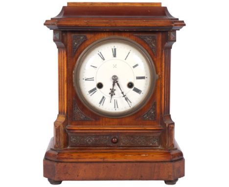 An early 20th century walnut-cased 8-day mantel clock, complete with key and pendulum, 14-day striking movement, with label f