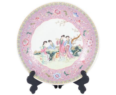 A large Chinese famille rose charger, enamel decoration decorated with figures, diameter 41cm, on standIn good condition 