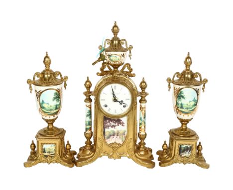 An impressive 3-piece clock garniture, gilt-metal frames, with ceramic pillars, with transfer print decoration, clock height 