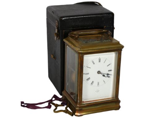 A 19th century French brass-cased carriage clock, 8-day striking movement, with enamel dial and Roman numerals, height not in