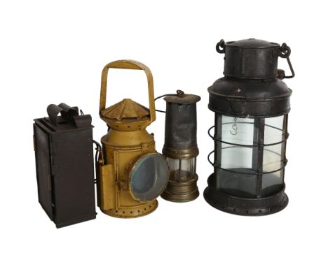 A WWW1 trench lantern, A WWW1Imperial German trench light, antique miners lamp, and a 1944 railway type lamp (4) 