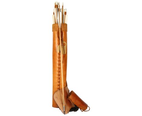 A vegetable tanned leather quiver, with arm guards and finger guards, with 20 wooden arrows, all bullet tipped, 2 different t