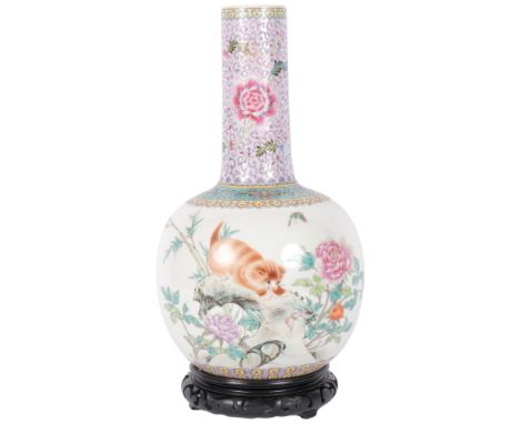 A large Chinese famille rose bottle vase, enamel decoration depicting a prowling cat, on carved hardwood stand, overall heigh