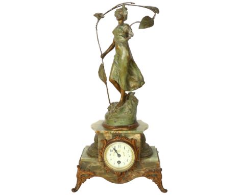 An 8-day striking stepped onyx mantel clock, floral decorated dial surmounted by a patinated spelter figure, H57cmMovement lo