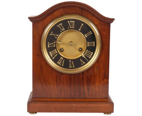 An early 20th century walnut-cased dome-top mantel clock, with 8-day bell striking movement, black and gilded chapter ring, c