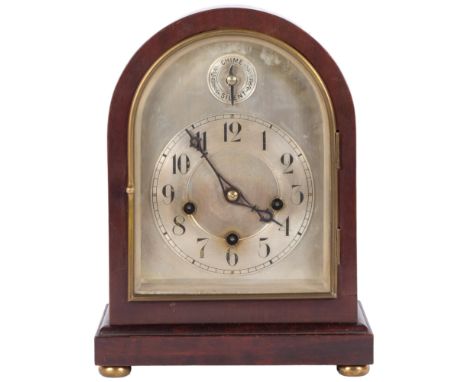 An Edwardian dome-top mantel clock with silvered chapter ring, 8-day gong striking movement, complete with pendulum but no ke
