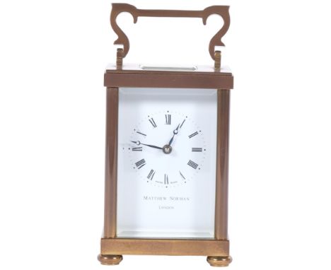 Matthew Norman, London, a brass-cased carriage clock, case height not including handle 11cm, complete with key and some paper