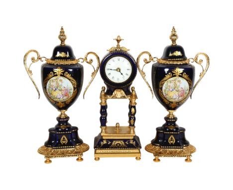 A Limoges blue cobalt and gold gilt 3-piece clock garniture, centrepiece clock has 4 outer pillars, H36cm 