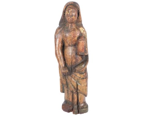 An 18th/19th century Italian polychrome wood carving of a lady in a cloak holding a candle, H60cmThere are visible natural sp