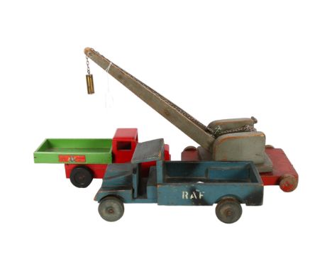 A Chad Valley wooden tipper truck, L30cm, an RAF wooden truck, and a scratch built wooden crane. 