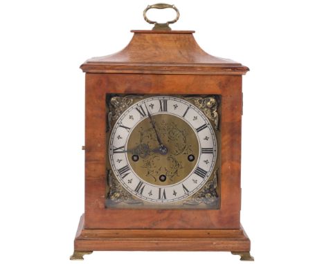 A walnut-cased mantel clock with engraved dial and silver chapter ring, with 8-day gong striking movement, made in Germany, s