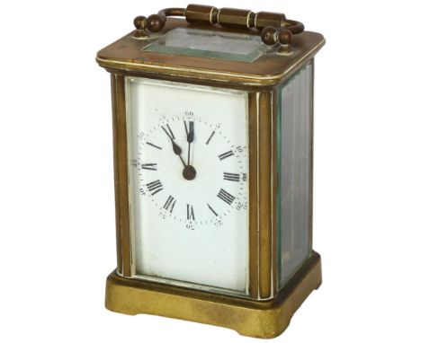 A French brass-cased carriage clock with enamel dial and Roman numerals, height not including handle 10.5cm,  key present but
