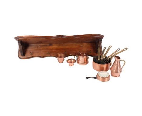 A set of 5 French coppery and brass-handled miniature pans, and hanging rack, various other miniature brass pots and timer 