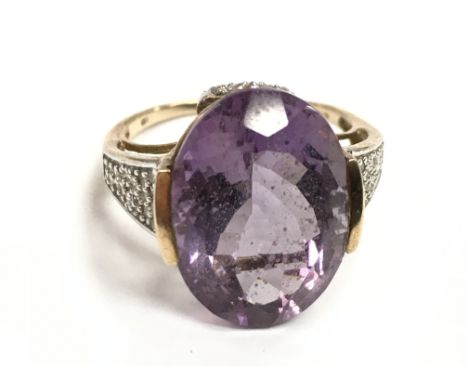 A 9 carat gold amethyst ring , 5.7g , size R postage category A