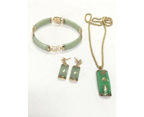 A collection of 9ct gold and jade jewellery including a Chinese bracelet, earrings , necklace with pendant. Postage category 