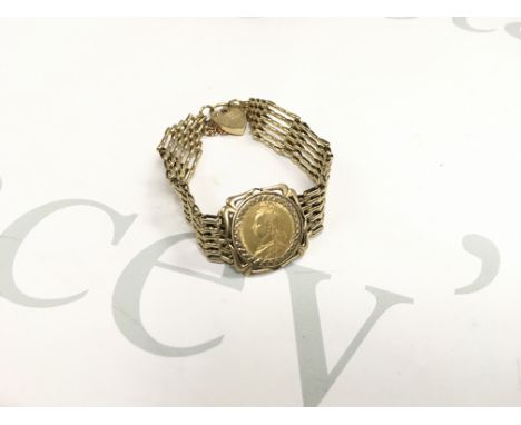 An 1892 shield back full sovereign in a gate bracelet mount. Approx weight 22.26 grams.