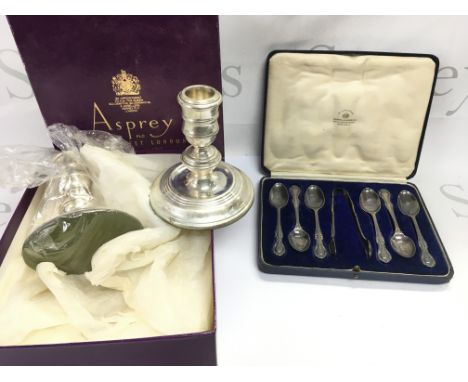 A pair of boxed Asprey hallmarked candlesticks and a cased set of Mappin and Webb silver spoons. Postage B