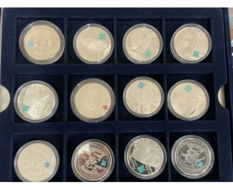 A good collection of sterling silver commemorative coins to include a a London 2012 Silver 50p sports collection and Royal Mi