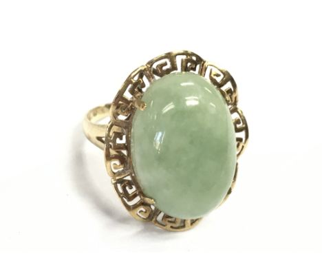 A 9 carat gold jade stone ring , size O. 5g Postage category A