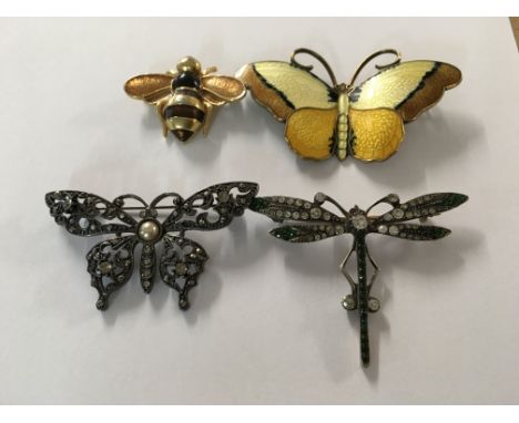 A collection of four butterflies and dragonflies brooches , including enamel .