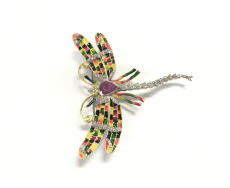 A silver dragonfly brooch / pendant set with a pear shaped ruby tsavorite garnet eyes and antennae and diamonds with enamel i