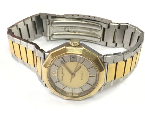 A Baume & Mercier Baumatic wrist watch , serial number 698081 postage category A