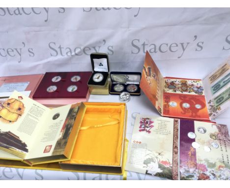 A collection of Chinese coinage including a number of silver 1 oz coins and Qing Dynasty coins. Postage B