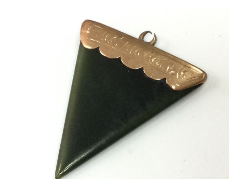 Small nephrite jade pendant with 9 carat gold mount, postage cat A