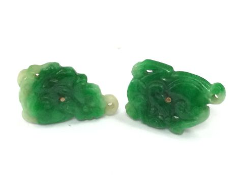 A pair of 9ct gold mounted jade studs . 3.6g total weight. Postage category A